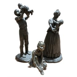 Two Heredities bronzed figures to include 'Mother and Son' and 'Father and Daughter' by Pauline Parsons, and another figure of a seated young ballerina, tallest 25.5cm