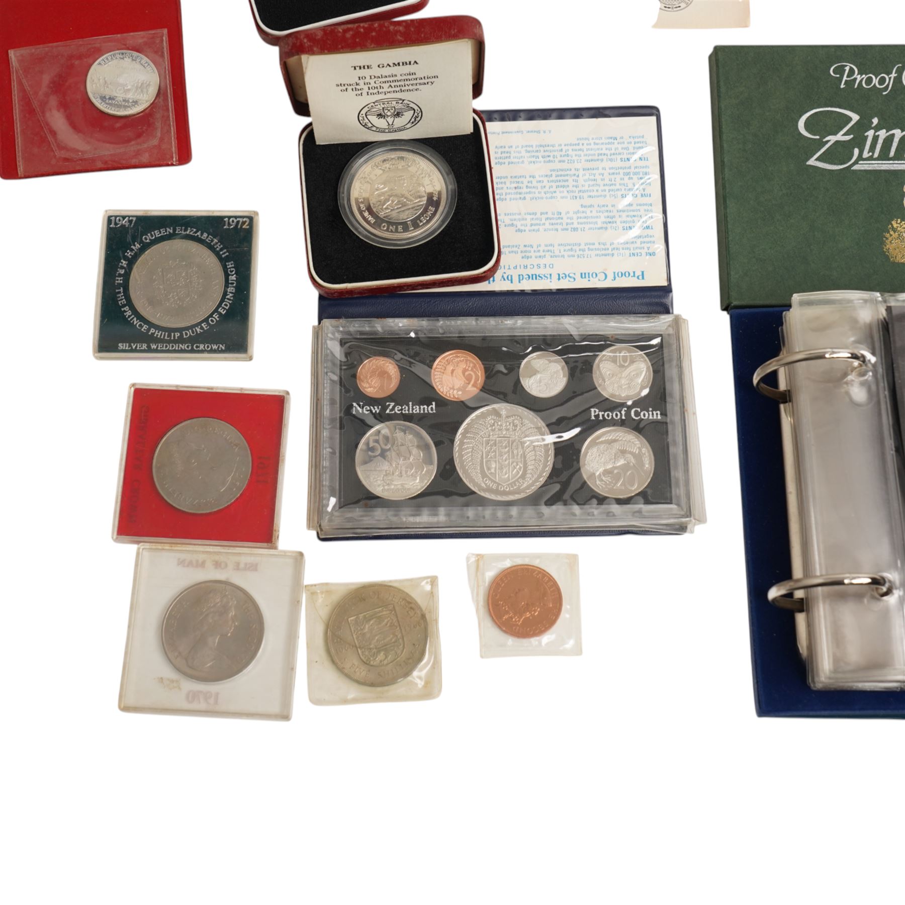 Three international proof coin sets produced by The Franklin Mint and containing high denomination silver coins, comprising Republic of Seychelles 1976 eight coin set, Republic of Panama 1976 nine coin set, Papua New Guinea 1976 eight coin set; four silver proof one ounce coins; eight Royal Mint international year sets, etc