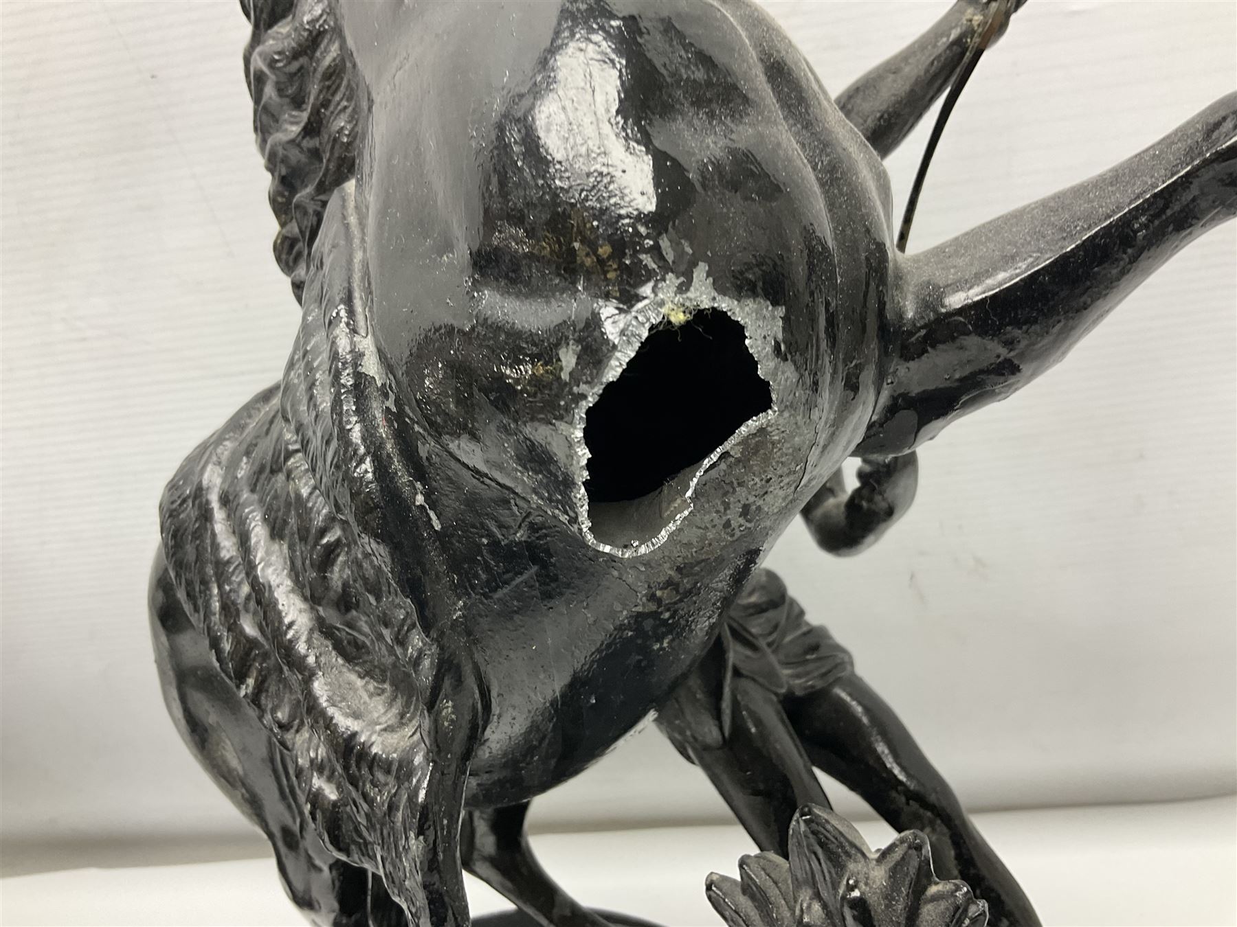 Pair of spelter figural statues of man and rearing horse, height 44cm and 42cm