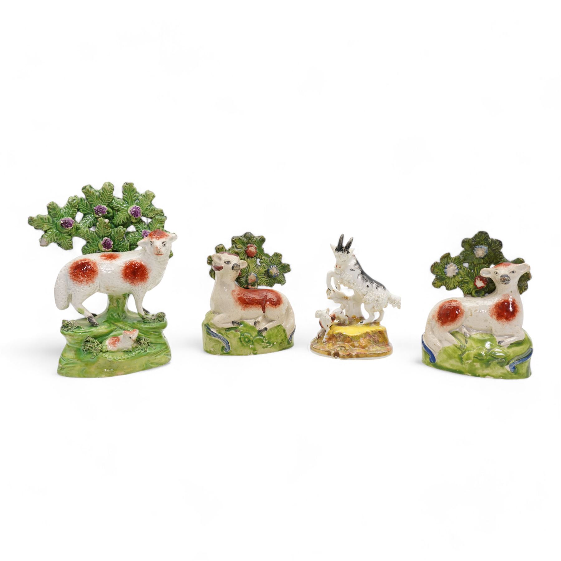 Early 19th century Staffordshire pearlware group by Ralph Salt, modelled as a sheep and lamb before a flowering bocage, impressed 'Salt' verso, H16cm, pair of similar Staffordshire pearlware sheep and ram and poodle group, numbered 198 beneath, with 'Max Bilbe Collection' label (4)