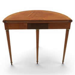 Regency revival mid 20th century walnut card table, demi lune form inlaid with boxwood, kingwood frieze with brass detail fold-over top with retractable back leg, revealing circular leather playing surface, circular tapering legs