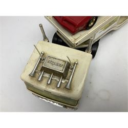 American Nylint large scale tin-plate car transporter L59cm carrying a Testor Toys plastic car; Tonka tin-plate mobile crane; boxed Sarony Cigarettes tin-plate roulette game with rules; and Japanese style tin-plate box, the lid inset with a revolving poker dice game (4)