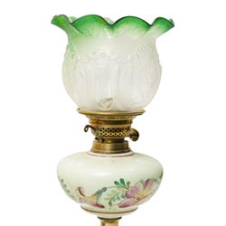 Victorian table oil lamp with floral painted yellow glass reservoir on brass column, another with cranberry glass reservoir and shade and another with painted green glass reservoir (3)