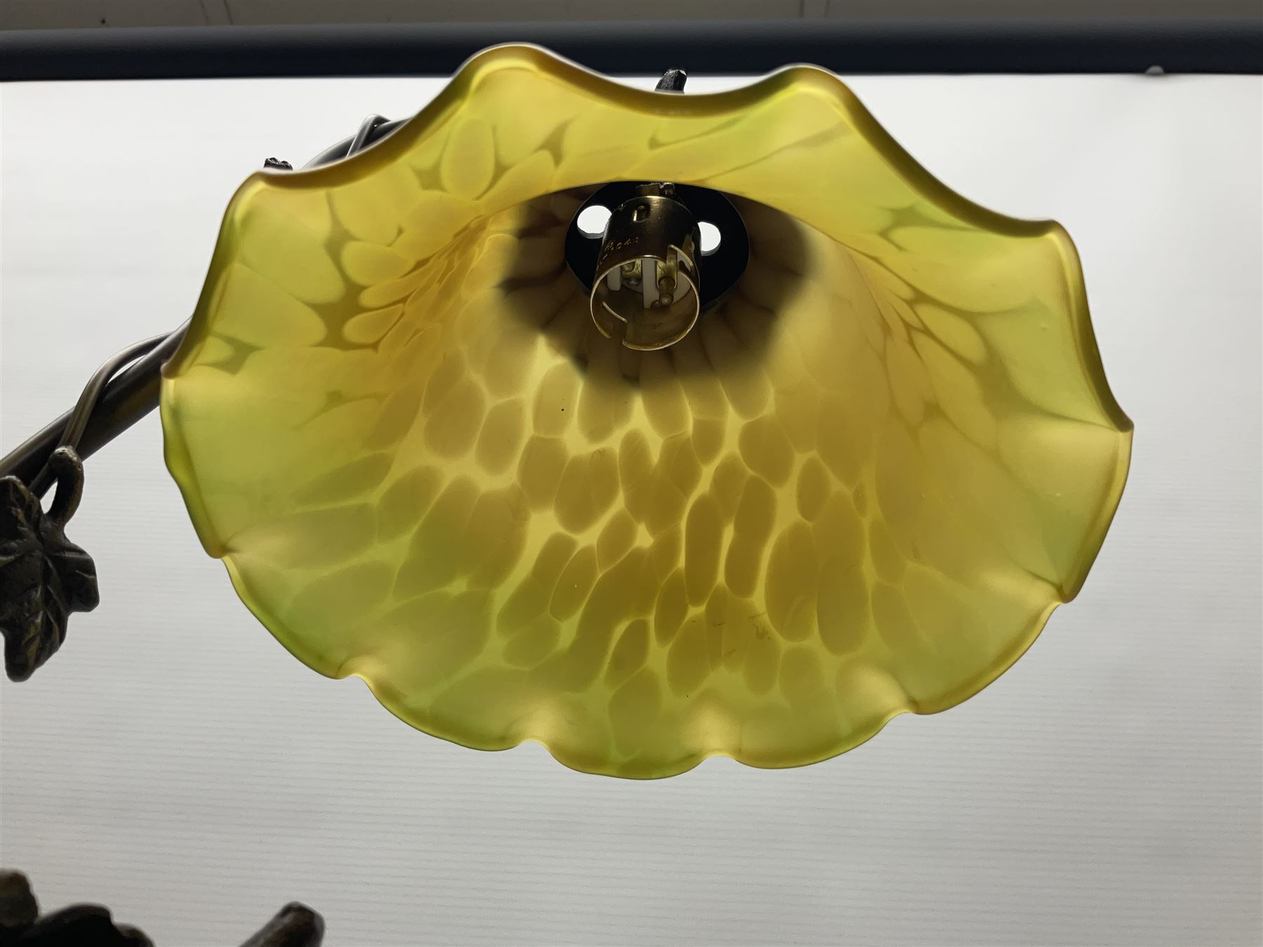 Art Nouveau style lamp in the form of a woman on a swing, with a green mottled shade, upon a marble base H52cm
