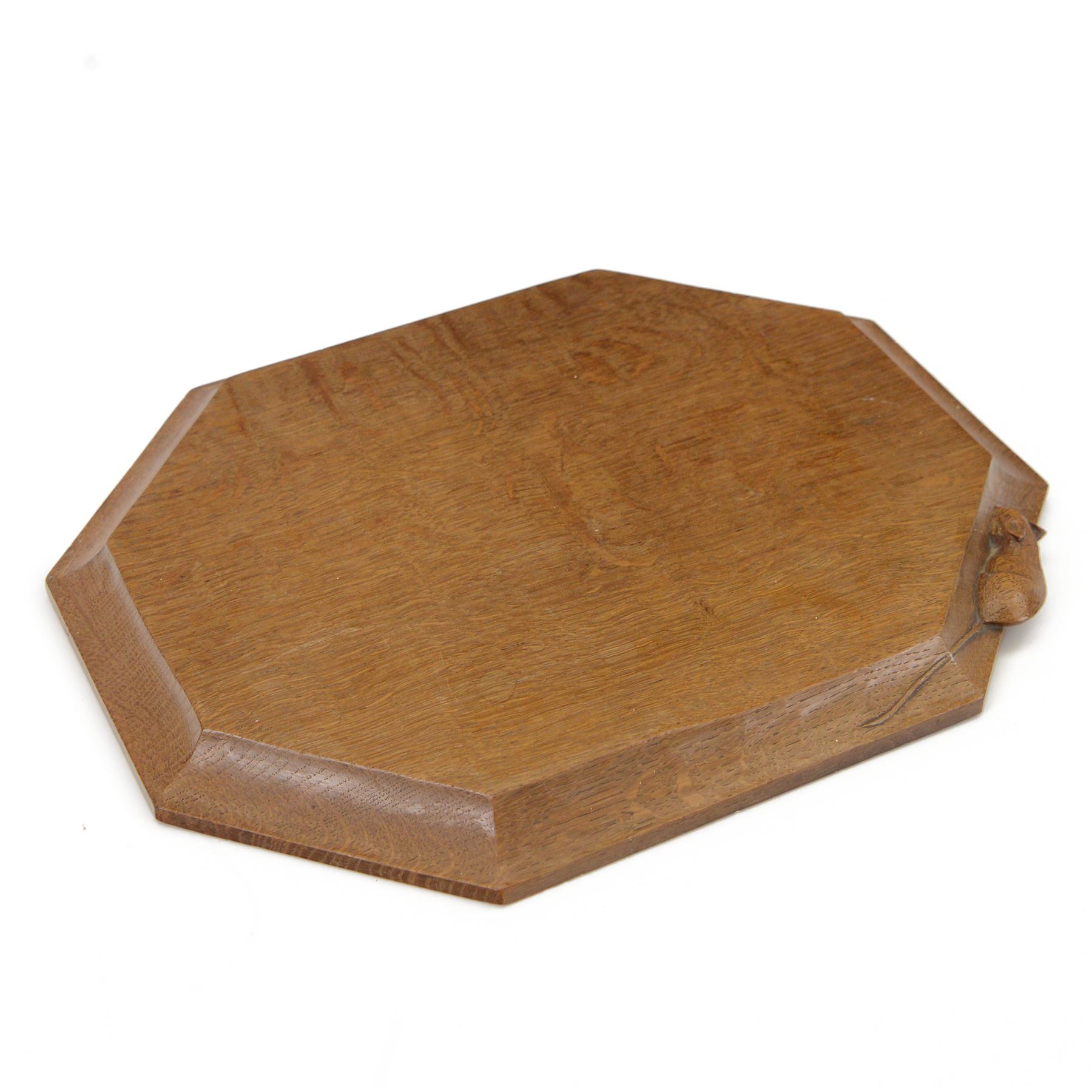 Mouseman - adzed oak breadboard or chopping board, canted rectangular form carved with mouse signature, by the workshop of Robert Thompson, Kilburn 