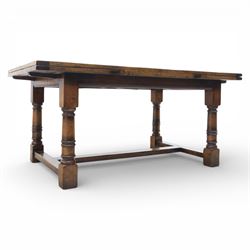 Titchmarsh & Goodwin - stained oak draw leaf dining table, raised on turned supports with H-stretcher, extends to 273cm