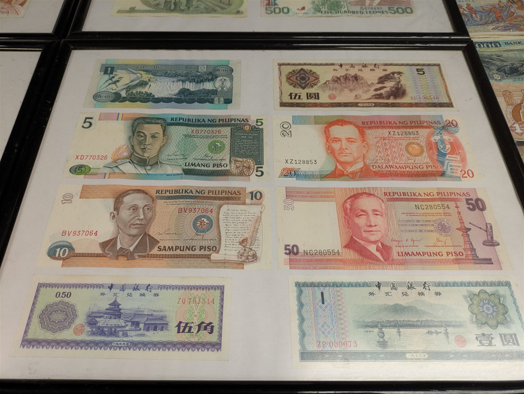 World banknotes, including Central Bank of Nigeria, Indonesia, Central Bank of Egypt, Republic of Liberia, Central Bank of Kenya, Central Bank of the Gambia, Singapore, Belgium etc, loose and in five framed displays