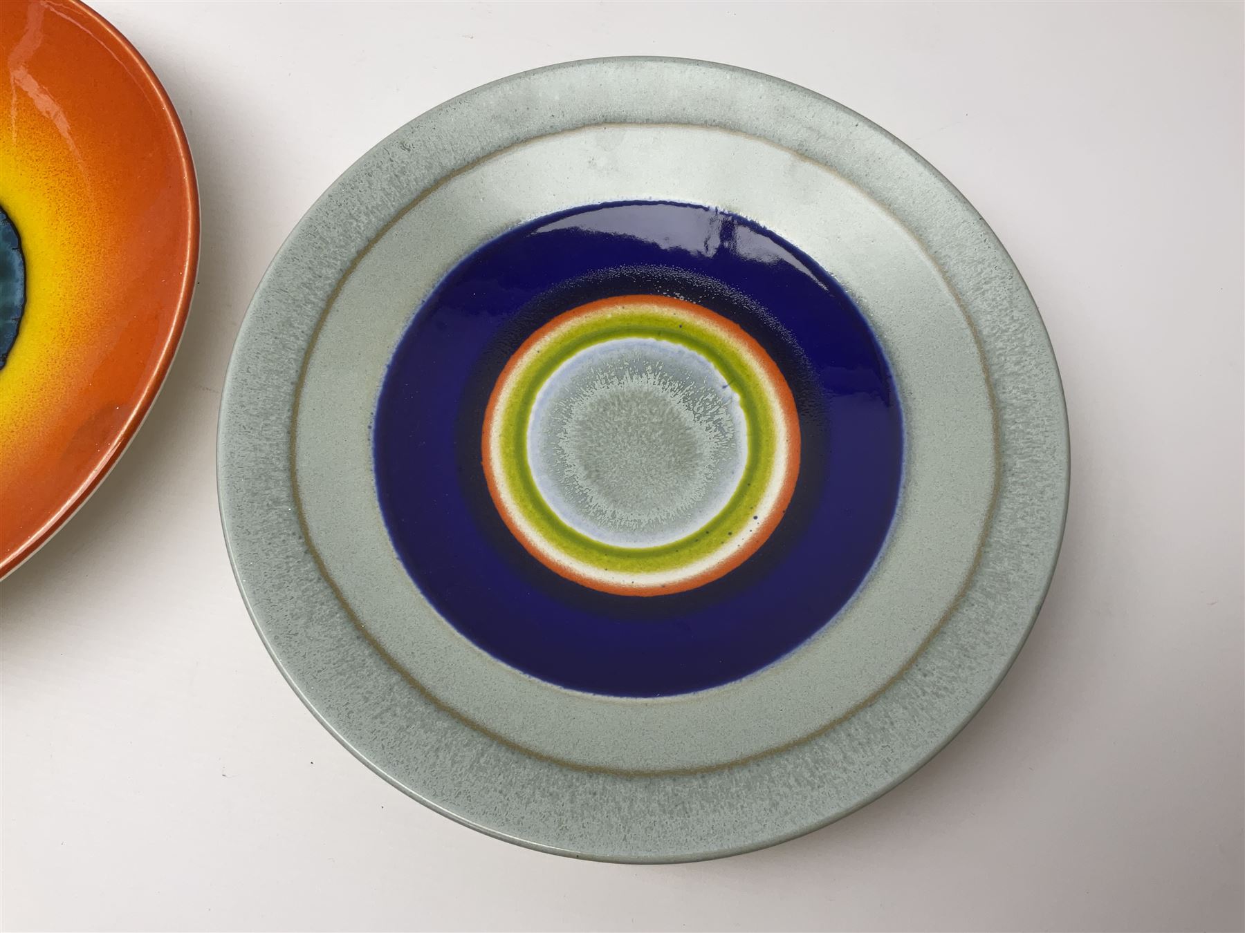 Poole Pottery The Planets, set of nine chargers 'The Planets, by Alan Clarke, comprising Mars, Mercury, Neptune, Venus, Uranus, Pluto, Jupiter, Saturn and Earth, all with original boxes and certificate, D27cm 