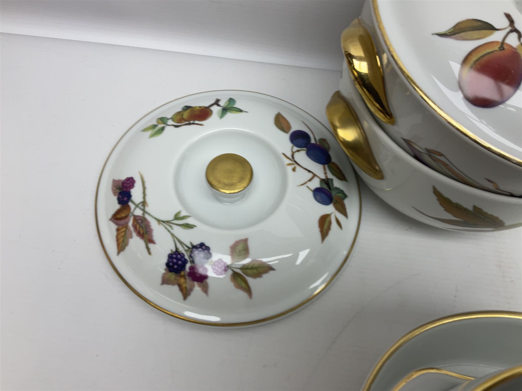 Royal Worcester Evesham pattern, including covered pot de cremes, twin handle tureen, serving dishes, flan dishes, side plates etc  