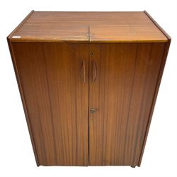 Mummenthaler & Meier - mid-20th century circa. 1960s teak 'Magic Box' folding desk cabinet, the cabinet opens to reveal shelves, writing desk, document holders and lamp, on castors