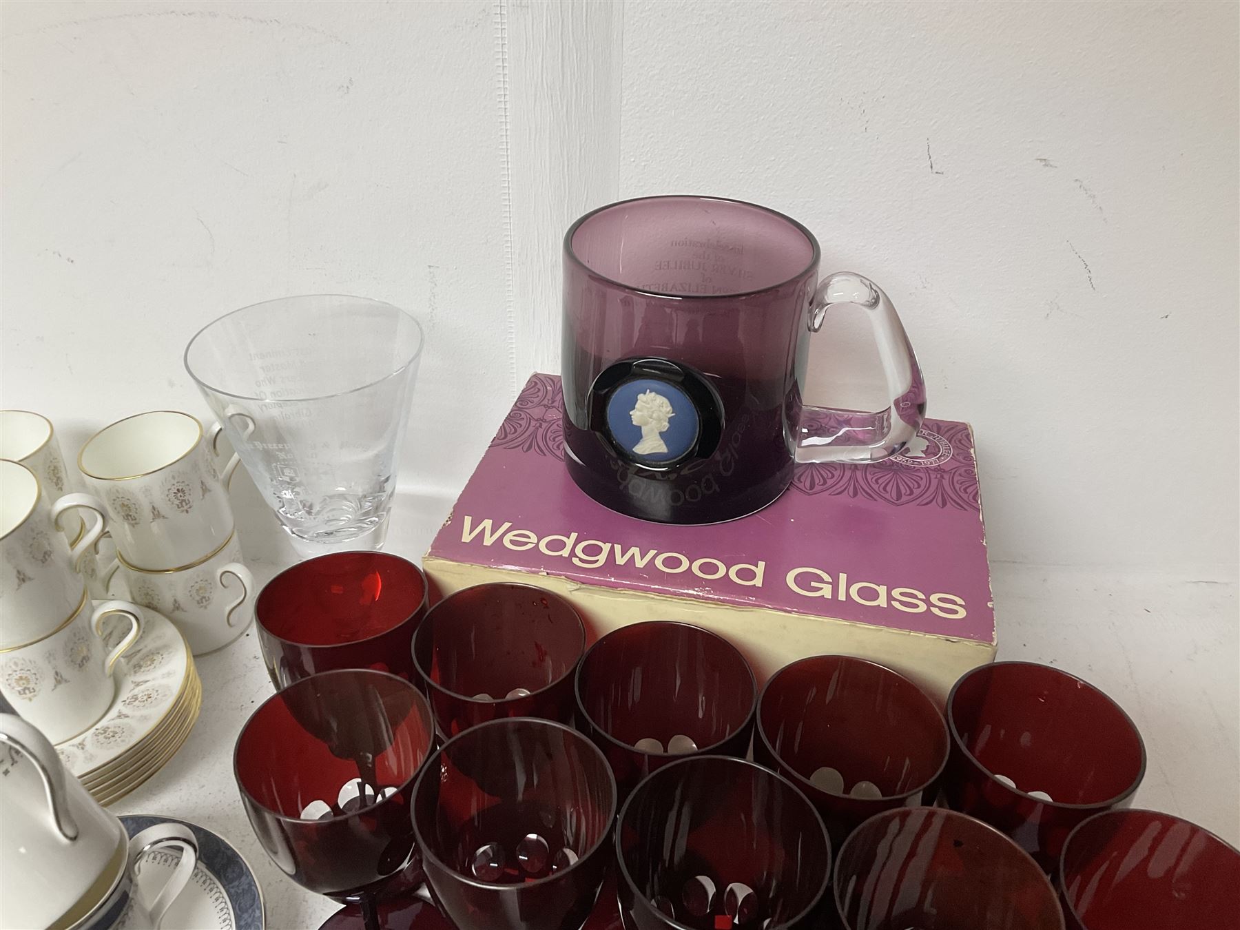 Twin handled sucrier with cover, in the manner of Thomas Grainger for Royal Worcester, together with Wedgwood Medina pattern coffee cans and saucers, a set of ten ruby glasses and a Wedgwood cameo glass tankard etc