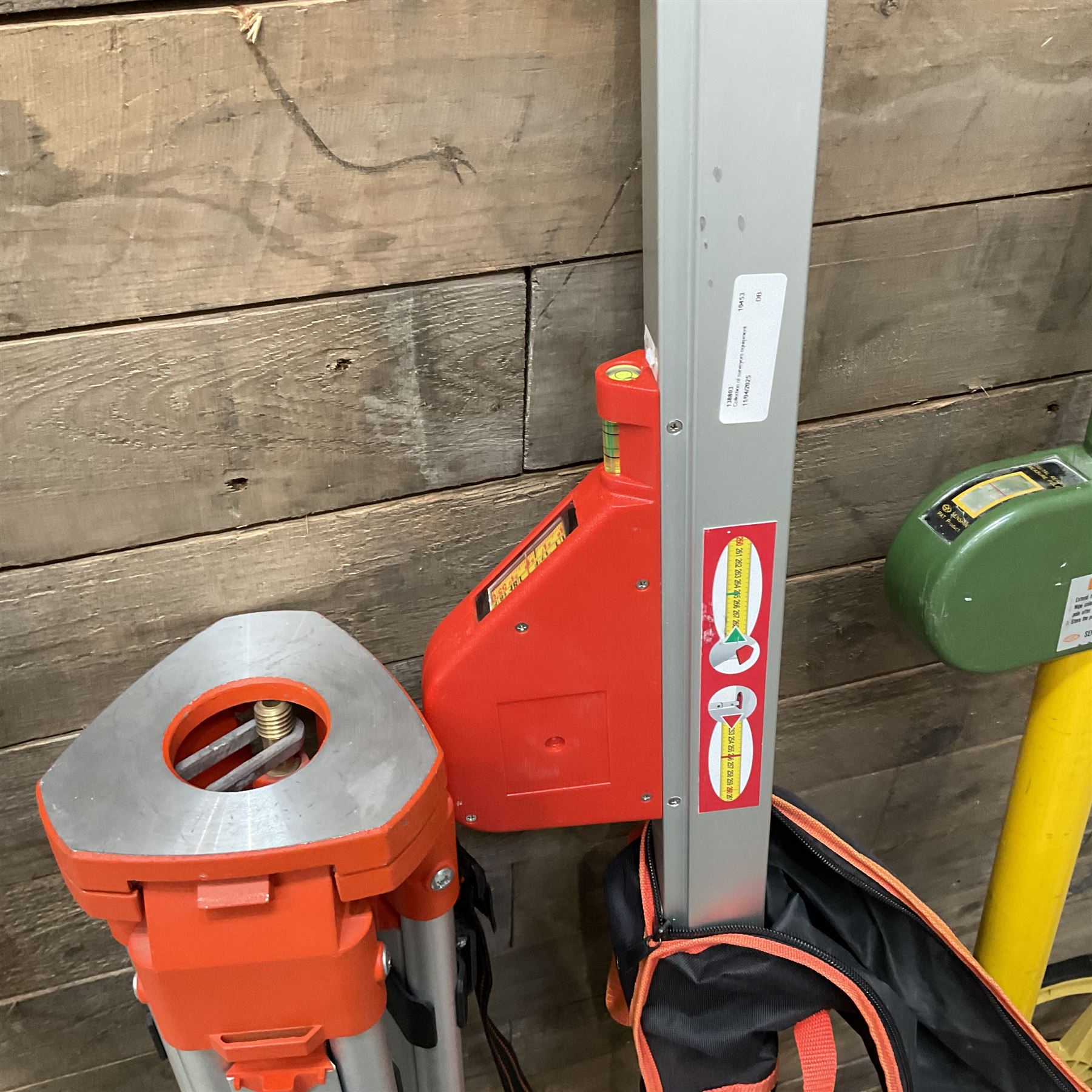 Collection of surveyors equipment including an automatic level and tripod stand and Hilka Pro Craft distance measuring wheel