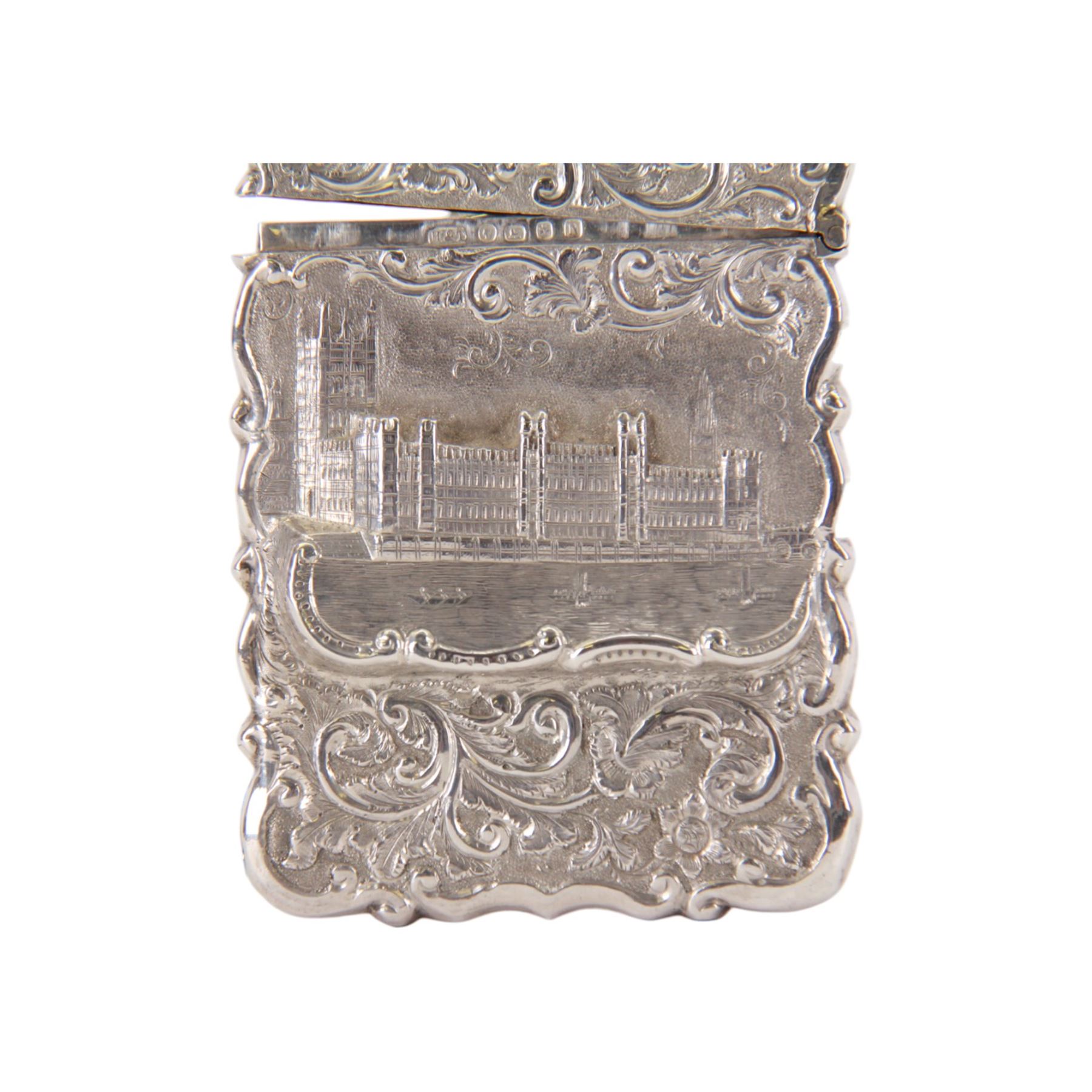 Victorian silver castle-top card case, of rectangular form with scrolling sides, relief embossed with the Houses of Parliament and surrounded by foliate scrolls, with vacant cartouche to reverse, hallmarked Hilliard & Thomason, Birmingham 1862, H9.5cm W6.5cm
