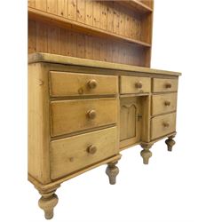 Victorian pine dresser, fitted with seven drawers and dog kennel cupboard, two heights plate rack