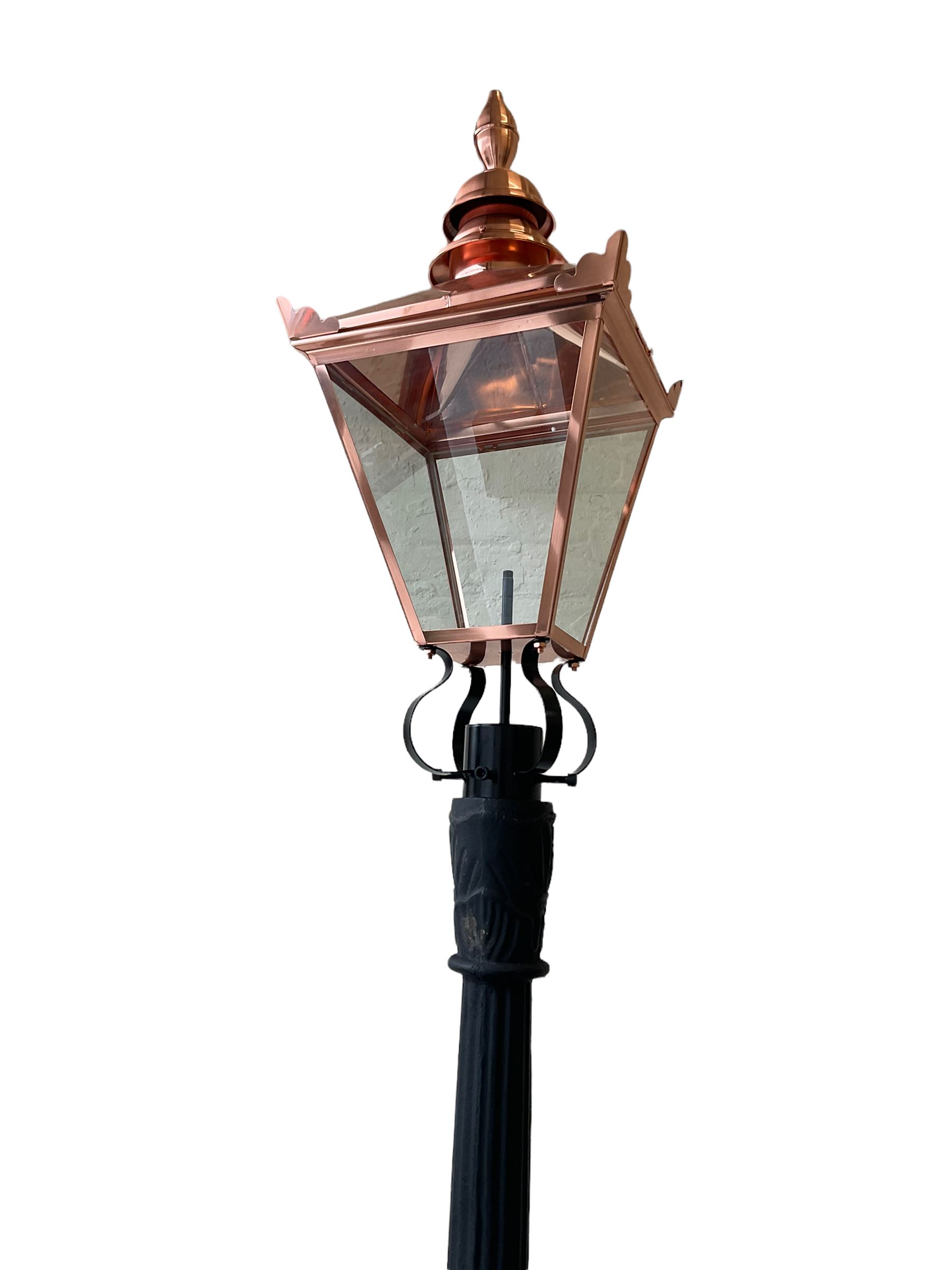 Victorian style cast iron street lamp post, with copper and glass lantern top
