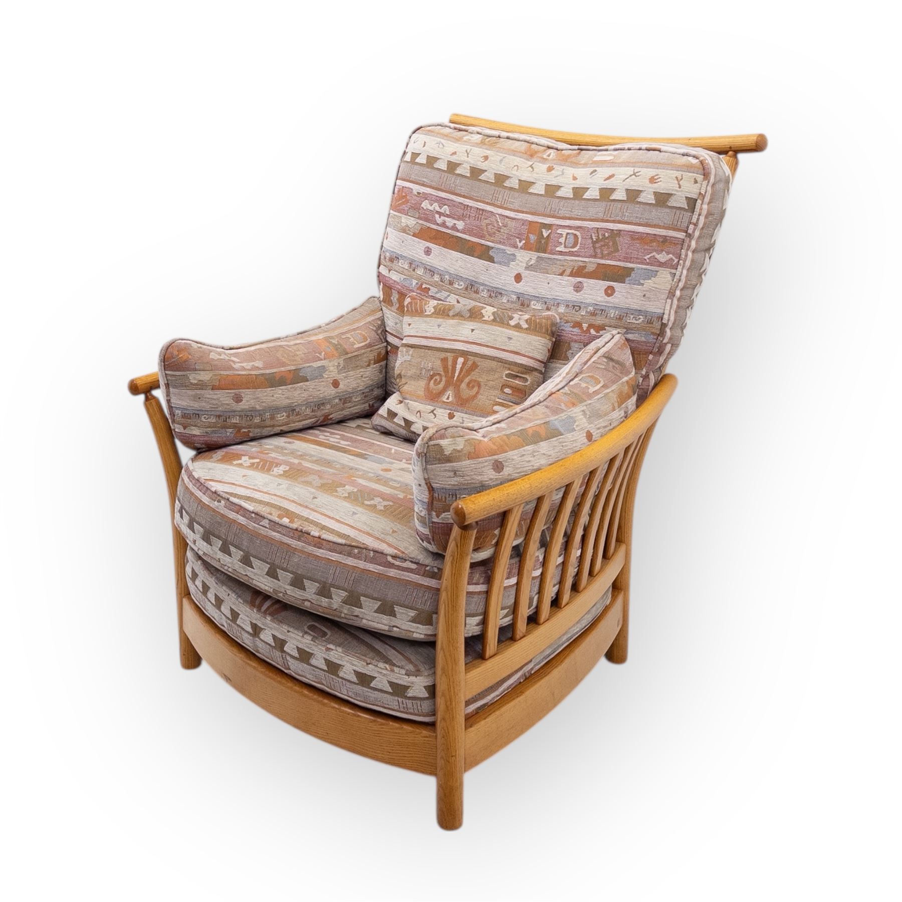 Ercol - Renaissance ash and elm high back armchair, upholstered in geometric Kilim patterned fabric with padded back, seat and arm cushions, curved stick back frame and turned supports