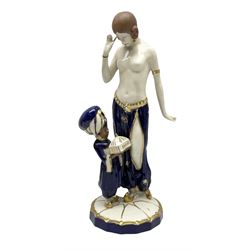 Royal Dux Art Deco figure group of Turkish dancing girl with a young boy beside her holding a casket, decorated with gilding, raised upon scalloped edge plinth base, with applied pink triangle and impressed 2948 beneath