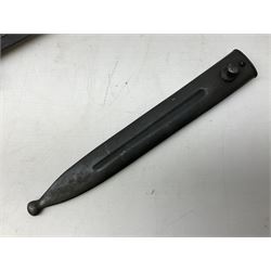 Swiss Model 1957 SIG rifle bayonet by Wenger with 23.5cm steel blade numbered 350857; in plastic scabbard with leather frog stamped GSCH 85 L38cm overall; and Egyptian Hakim rifle bayonet with the same script number to the grip and steel scabbard (2)