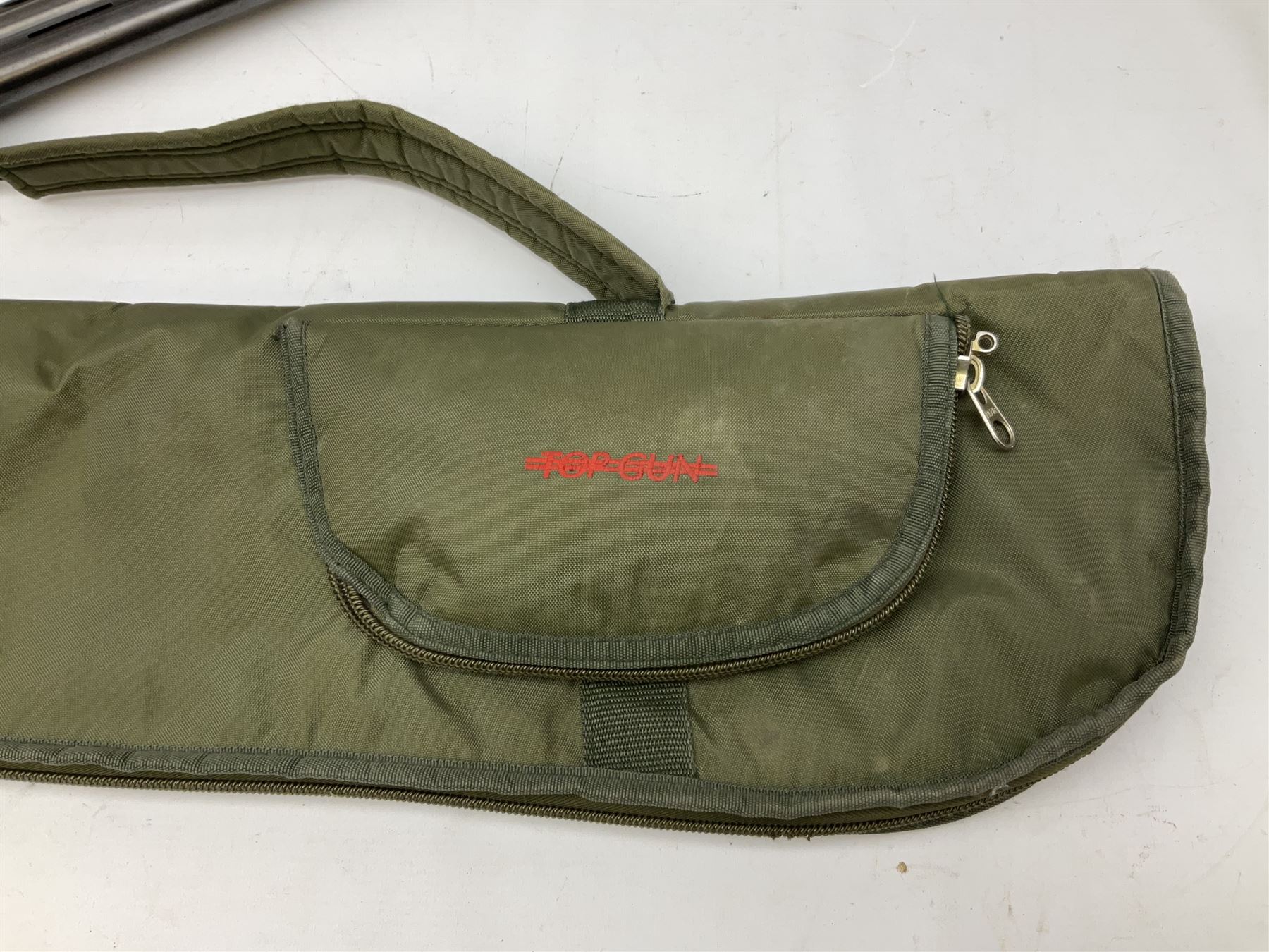 Winchester Japan 5500 12-bore by two-and-three quarters over-and-under double barrel boxlock ejector sporting gun, with 71cm barrels, ventilated rib and barrels, the walnut stock with chequered pistol grip and fore-end, single selective trigger and top safety, serial no.K542927E, L115cm overall; in gun sling SHOTGUN CERTIFICATE REQUIRED