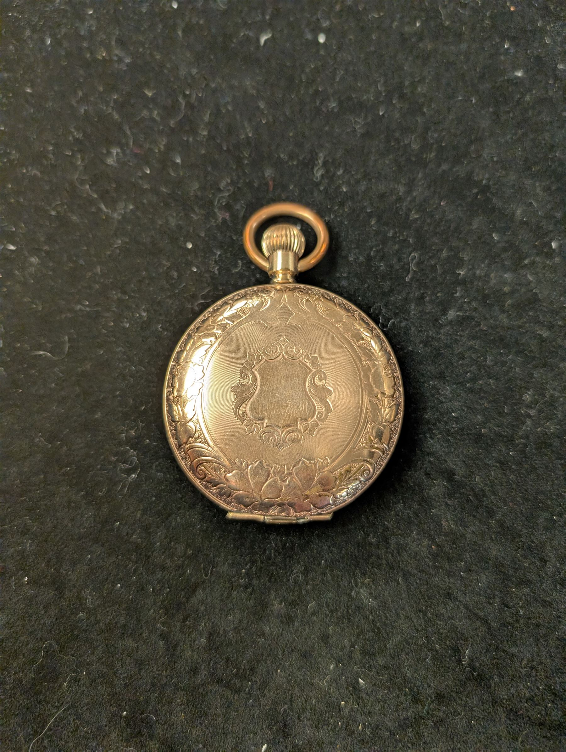 Waltham USA gold plated full hunter pocket watch, the white enamel dial with subsidiary seconds dial, the front cover engraved and embossed with blank cartouche in a floral border, the back cover engraved with stag