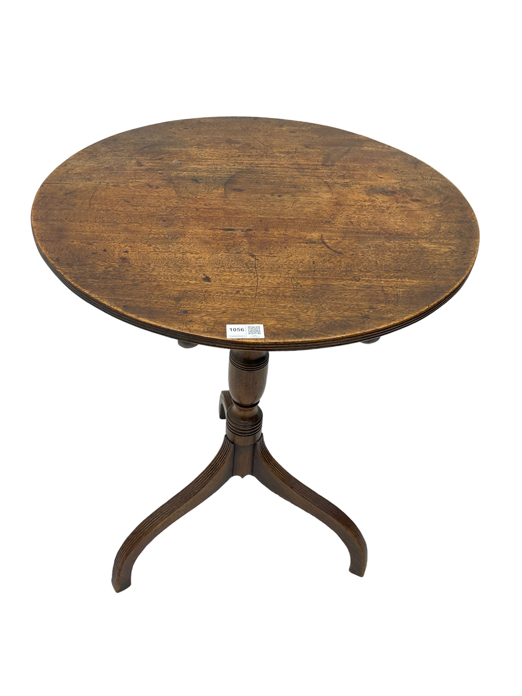 Early 19th century mahogany tilt-top pedestal table, the circular top with reeded edge, raised on turned support with reeded tripod base