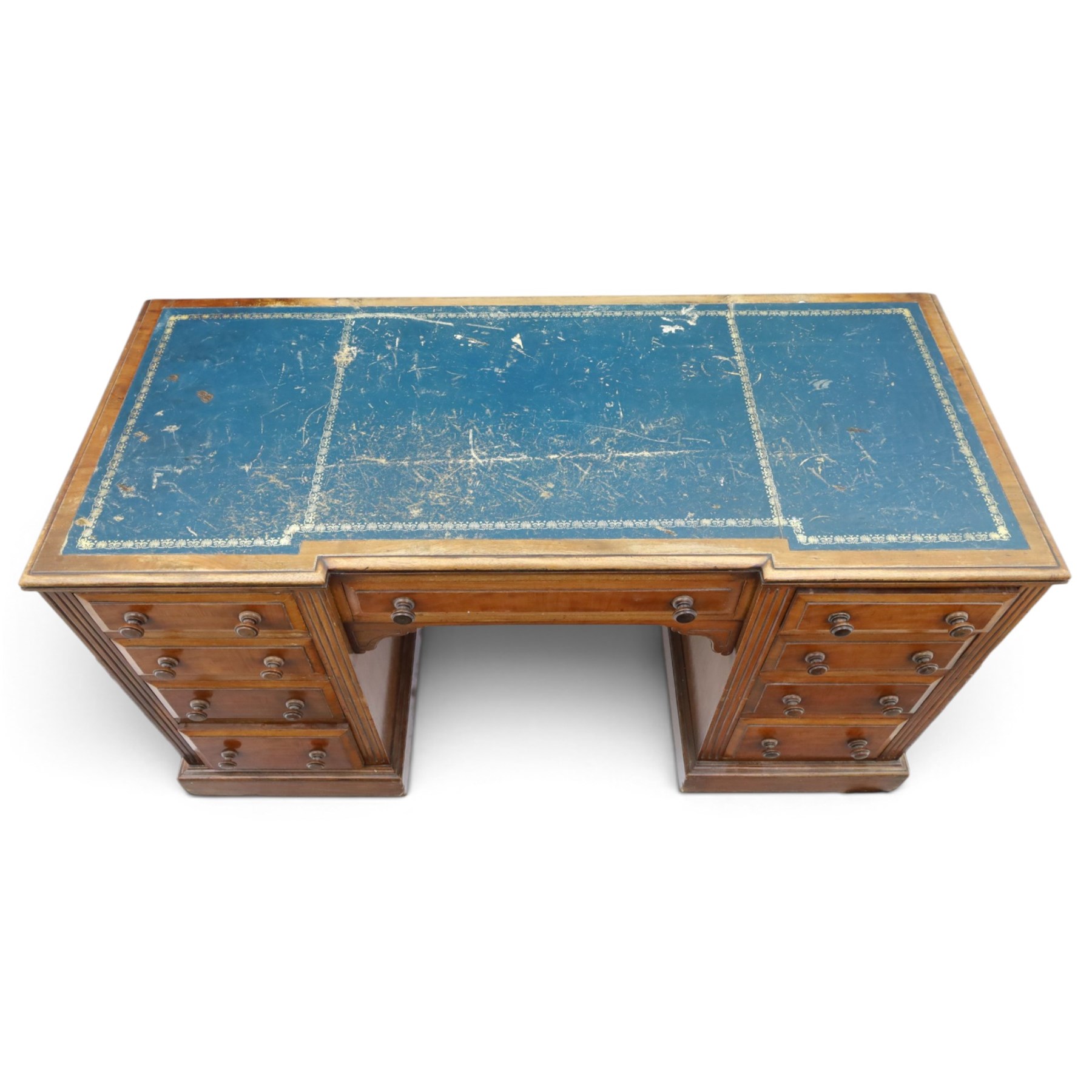 Victorian mahogany inverse breakfront twin pedestal desk, inset leather top over central drawer, flanked by pedestals with four graduating drawers, raised on a plinth base