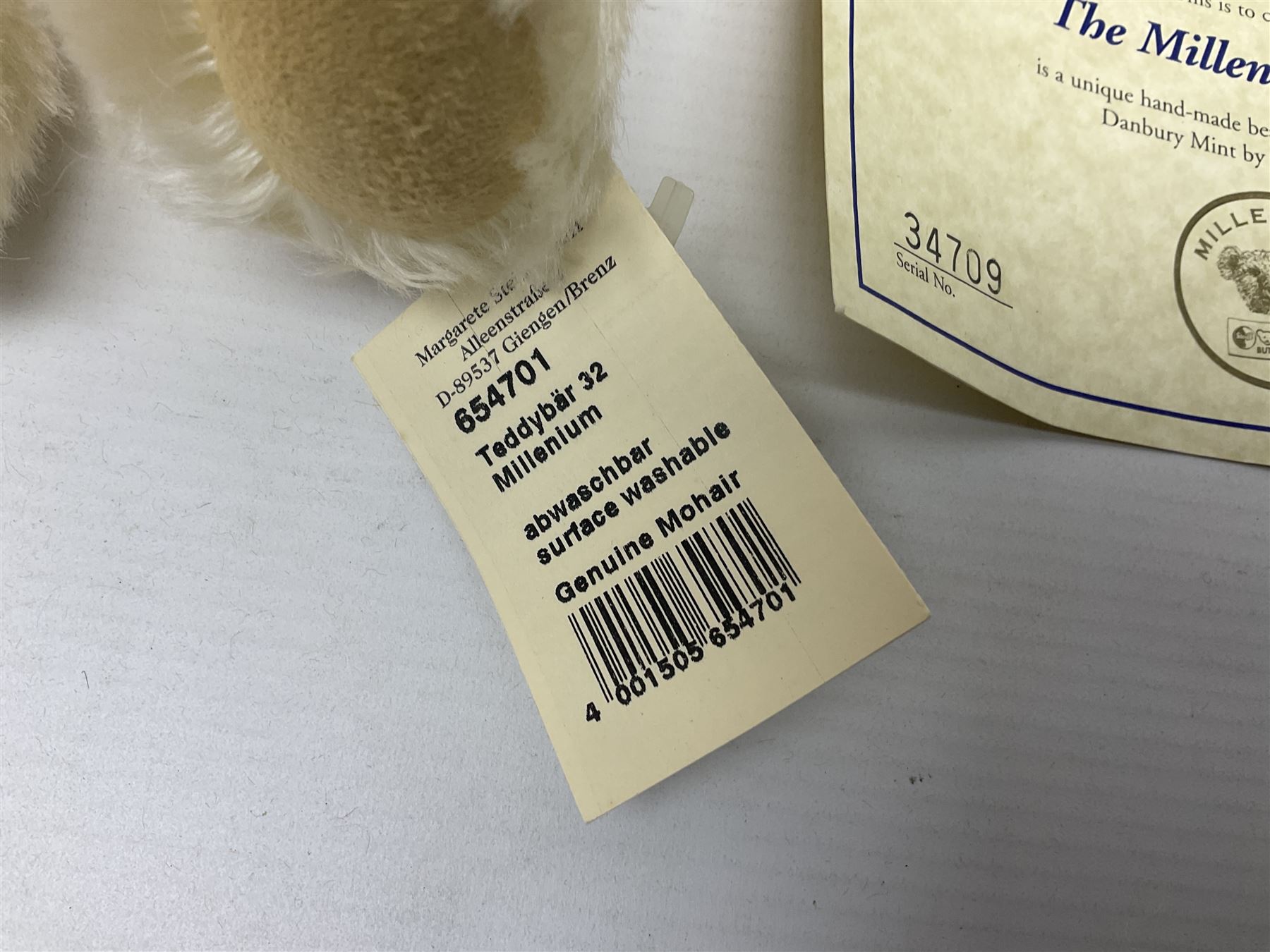 Modern Steiff teddy bear - The Millenium Bear No.34709 with golden pendant H32cm; in original box with paperwork; together with a Steiff ball-point pen in case sent to the vendor as compensation for a delay in receiving the bear.