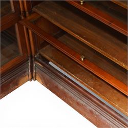 Globe Wernicke - early 20th century corner bookcase, comprising six sections, panelled sides raised on a moulded plinth base  