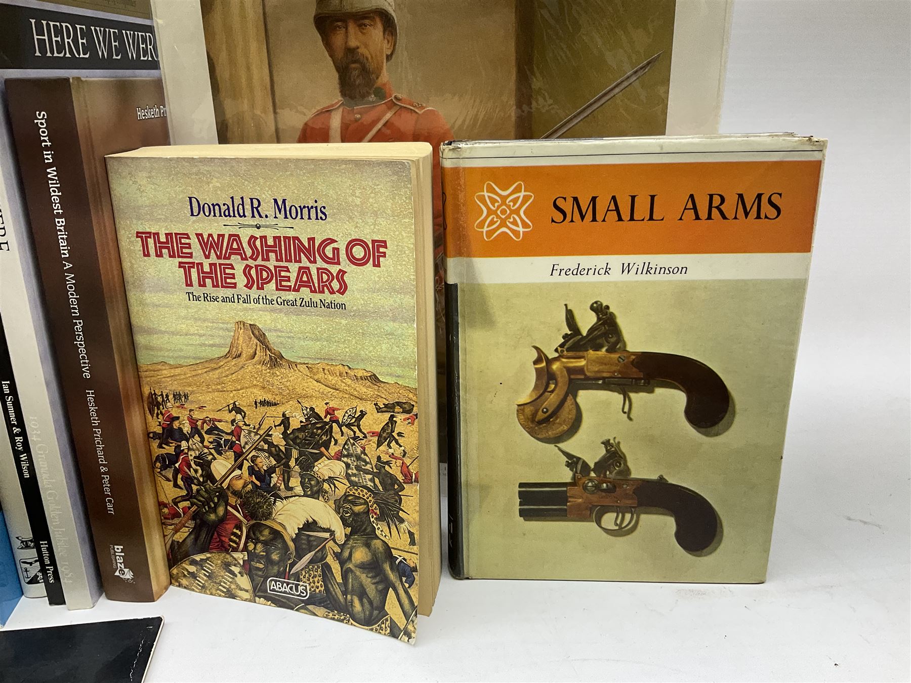 Sixteen books/booklets on guns and shooting including 1969 Holland & Holland Catalogue; two Gunmark Guides to Good Shooting; Shooters Bible 1972 etc; and small quantity of militaria books