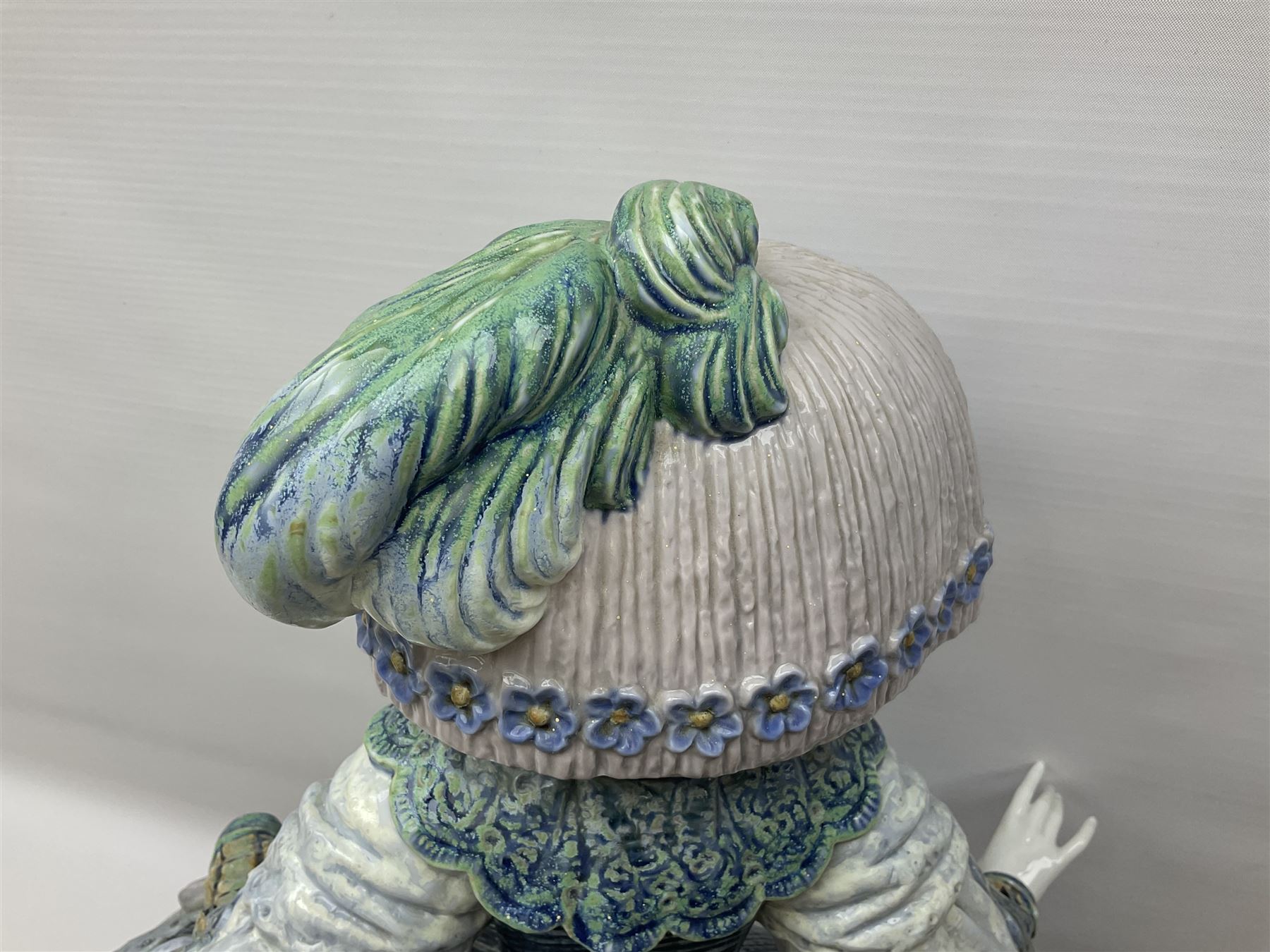 Large Lladro figure, La Menina, modelled as a maid of honor in service, on a mahogany oval base, limited edition 99/1000, sculpted by Jose Puche, with certificate of authenticity, framed and glazed, no 1812, year issued 1996, year retired 2019, H60cm