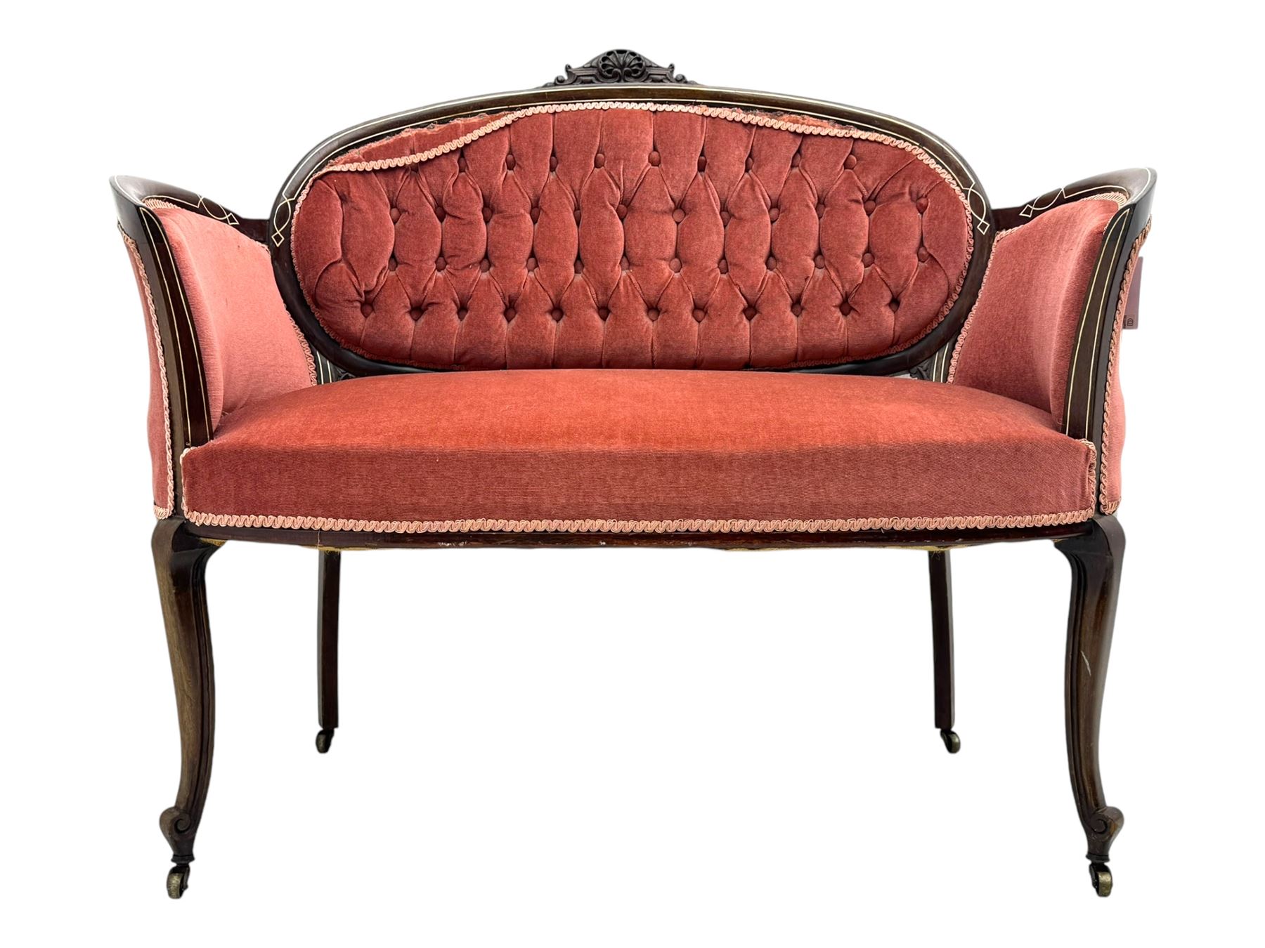 Edwardian inlaid rosewood parlour suite, comprising pair of tub shaped armchairs (W77cm, D69cm, H88cm); and matching two-seat sofa (W112cm, D69cm, H88cm), each with carved crest rails with shell motifs, deep button-tufted oval backs upholstered in pink fabric with braid trim, on cabriole supports