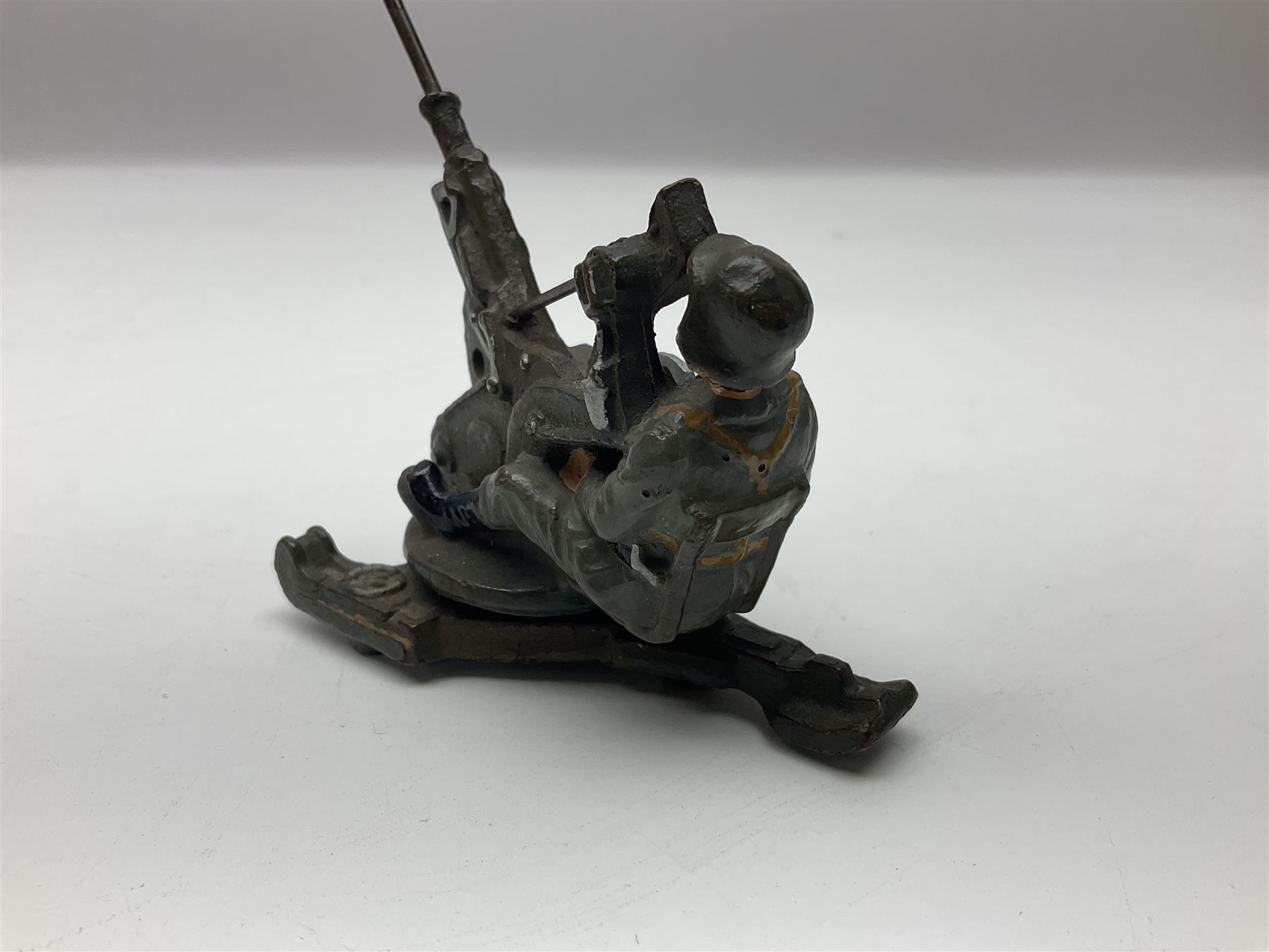 German Lineol Flak Artillery Gun on revolving base H11cm; four other Lineol WW2 German soldiers; and three Elastolin German soldiers including reclining radio operator (8)