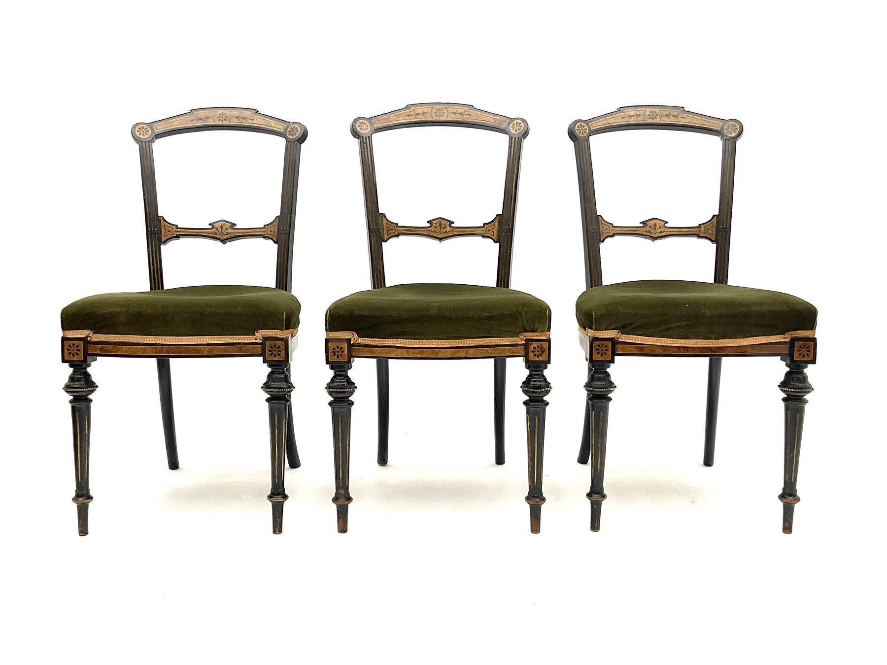 Set three late Victorian salon side chairs, ebonised frames inlaid with amboyna wood, with applied brass beading, turned and fluted supports with gilt detail