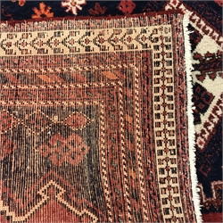 Persian style red and blue ground rug, three central diamonds, repeating border, 220cm x 165cm