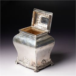 Edwardian silver tea caddy of bombe outline with shell moulded finial, shell moulded and gadrooned base on scroll feet H15cm London 1902 Maker Thomas Bradbury & Sons