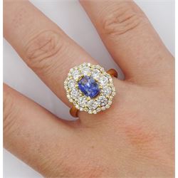 18ct gold radiant cut Ceylon sapphire and round brilliant cut diamond cluster ring, hallmarked, sapphire approx 1.20 carat, total diamond weight approx 1.40 carat