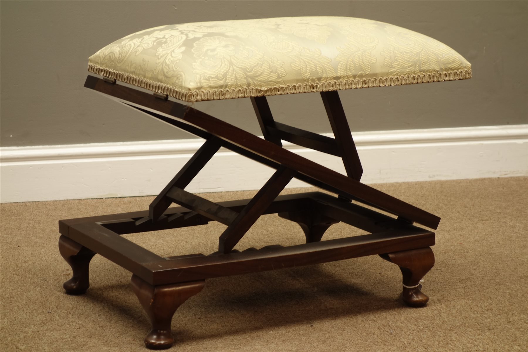 20th century mahogany double hinged adjustable gout stool, upholstered in damask fabric, W52cm