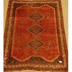  Persian Shiraz red ground rug, triple pole lozenge medallion, decorated all over with animal, bird and flower stylised motifs, 256cm x 195cm  