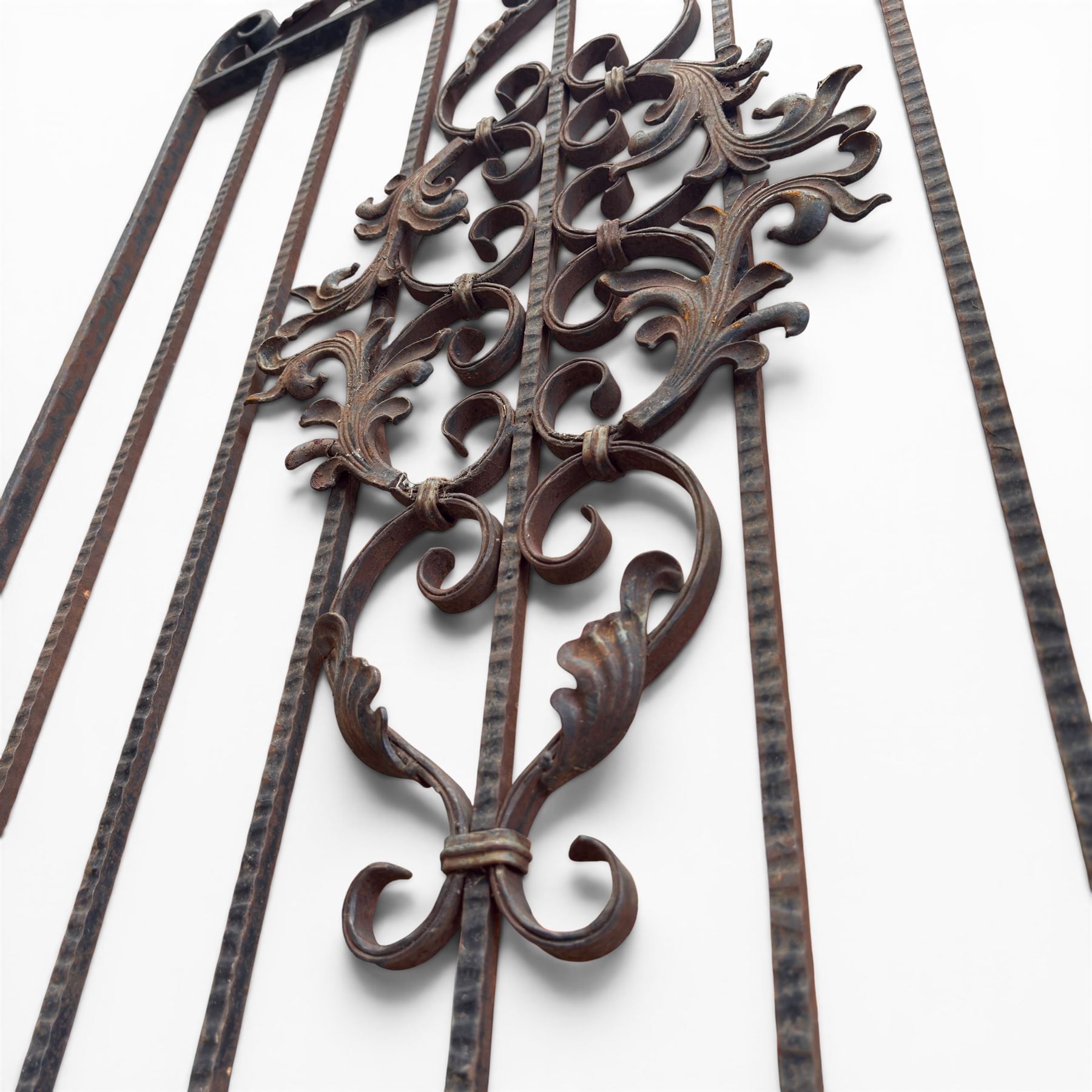 Victorian wrought iron vineyard gate, with ornate scrollwork and foliate acanthus leaf decoration, shaped cresting and central decorative panel, finished in rustic black painted finish