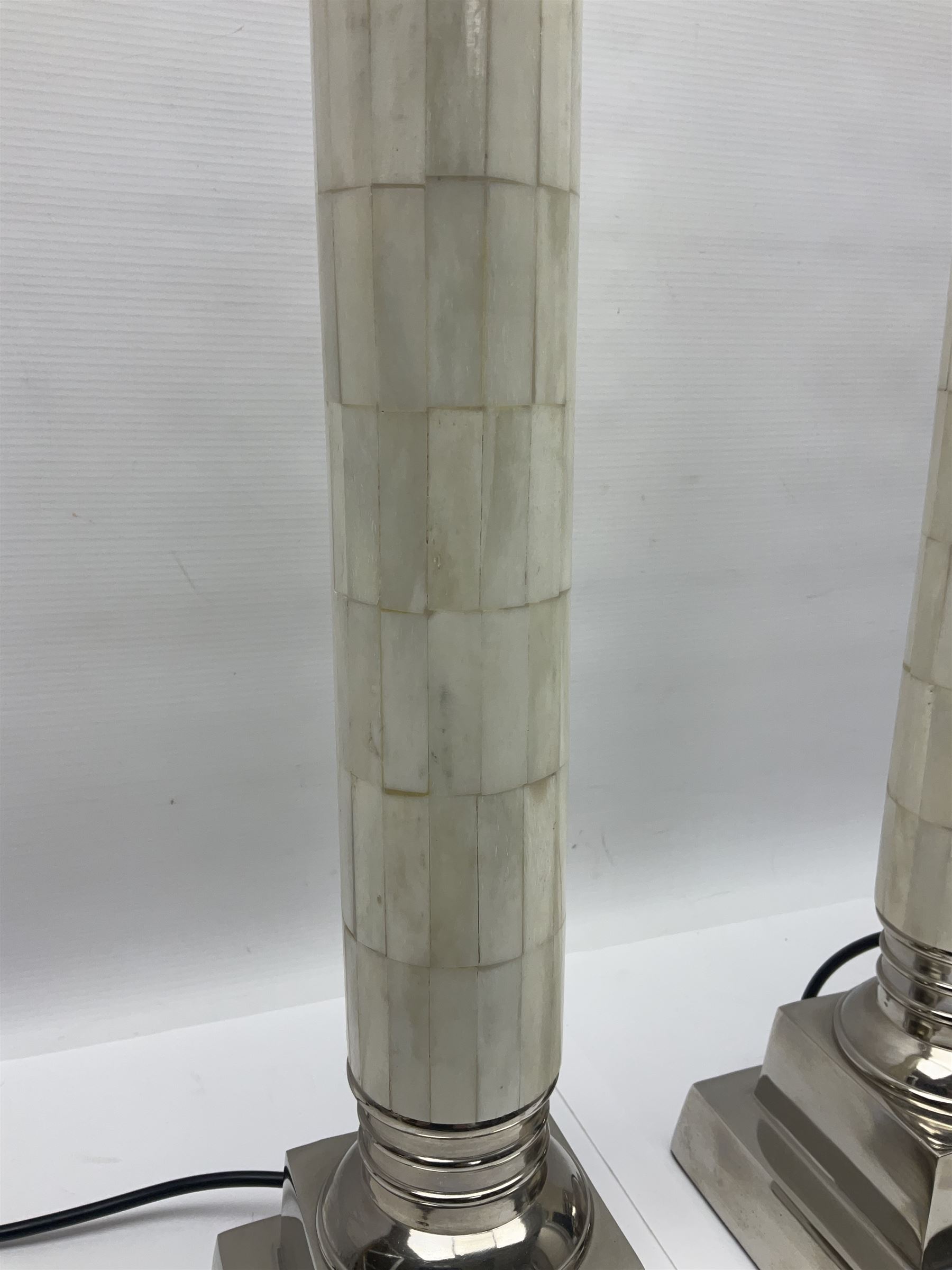 Pair of Parex table lamps, each of columnar form, the column with mosaic design standing on a stepped plinth, H68cm
