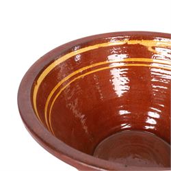 19th century terracotta bread pancheon, of circular form, the glazed interior with slip decoration, H21cm, D43cm