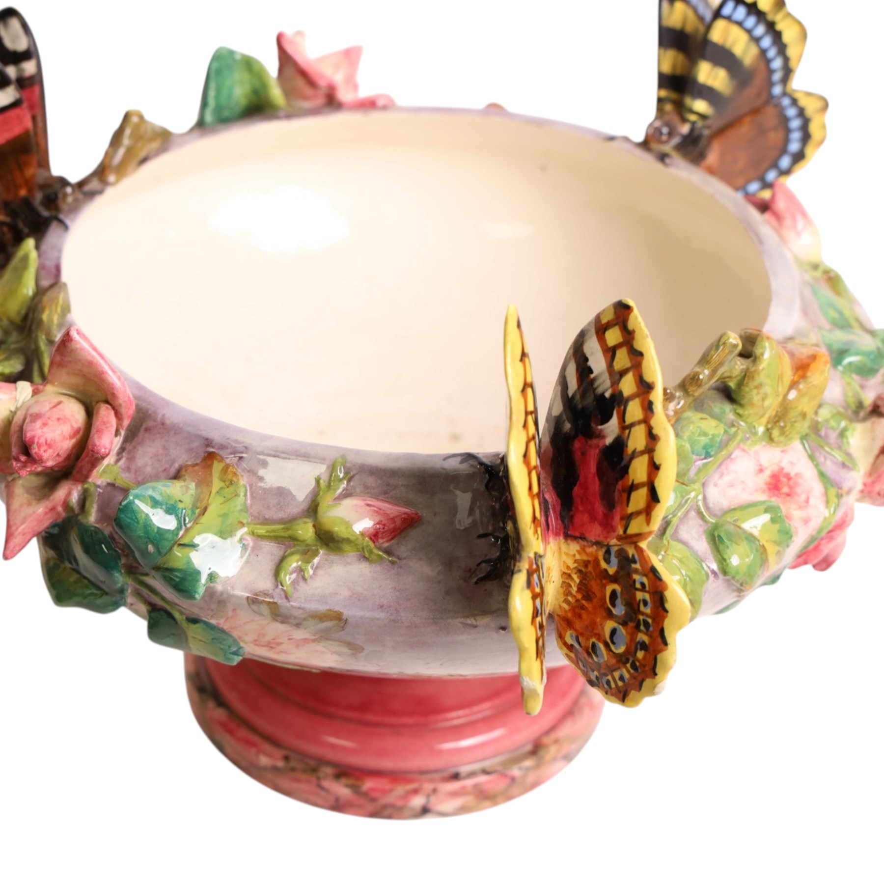 Delphin Messier (1836-1907), glazed earthenware cache-pot, decorated with three butterflies surrounded by floral and foliate motifs. upon a pink circular foot, signed beneath, H24cm