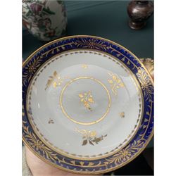  19th century Coalport Felt Spar porcelain cup and saucer painted with panels of flowers on a green and gilt ground and marked I Rose & Co and an early 19th century Worcester trio decorated in blue and gilt, Pattern No.274 