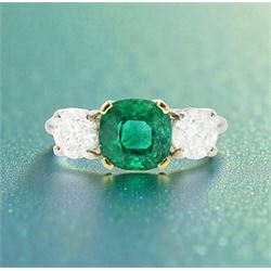 Platinum emerald and diamond three stone ring, single cushion cut emerald of approx  1.85 carat, set with a single round brilliant cut diamond either side, hallmarked, total diamond weight approx 1.20 carat