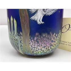 Okra limited edition glass vase, Night Owl, no 19/50, designed by Terri-Louise Colledge, of oval form, painted with a barn owl taking flight amongst leafy branches, upon an iridescent blue ground, etched marks and dated 2002 beneath, with limited edition certificate, H16.8cm, unboxed 