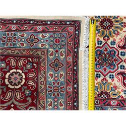 Northwestern Persian Hamadan carpet, hand-knotted, ivory field with an all-over Herati design of rosettes and serrated leaves within multiple borders, madder red with angular vine and rosette motifs, 375cm x 271cm 