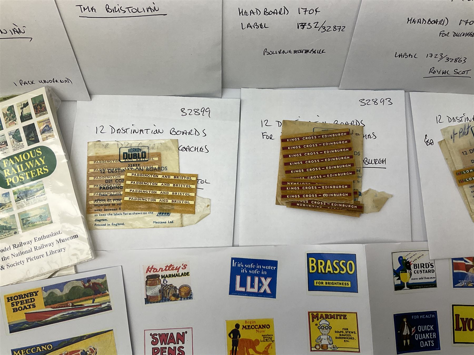 Hornby Dublo etc - large quantity of labels etc comprising headboards and train names including Mallard, Mancunian, Bristolian, Royal Scot, Flying Scotsman, Red Rose, White Rose, etc; destination boards for corridor coaches; station names; miniature posters; insulating tabs; lubricating oil etc; many in original packets.
