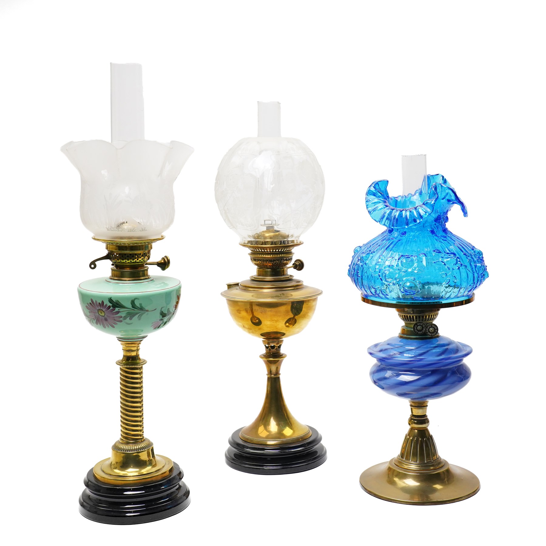 Victorian brass table oil lamp with painted green glass reservoir, another with blue glass reservoir and one other lamp (3)