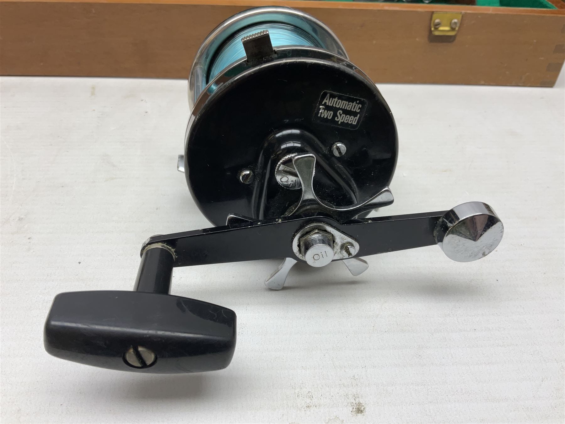 Four Abu fishing reels, comprising Ambassadeur 9000, Ambassadeur 7000, Ambassadeur 5500 and Ambassadeur 6500, together with additional line, hardy fishing bag and two wooden boxes