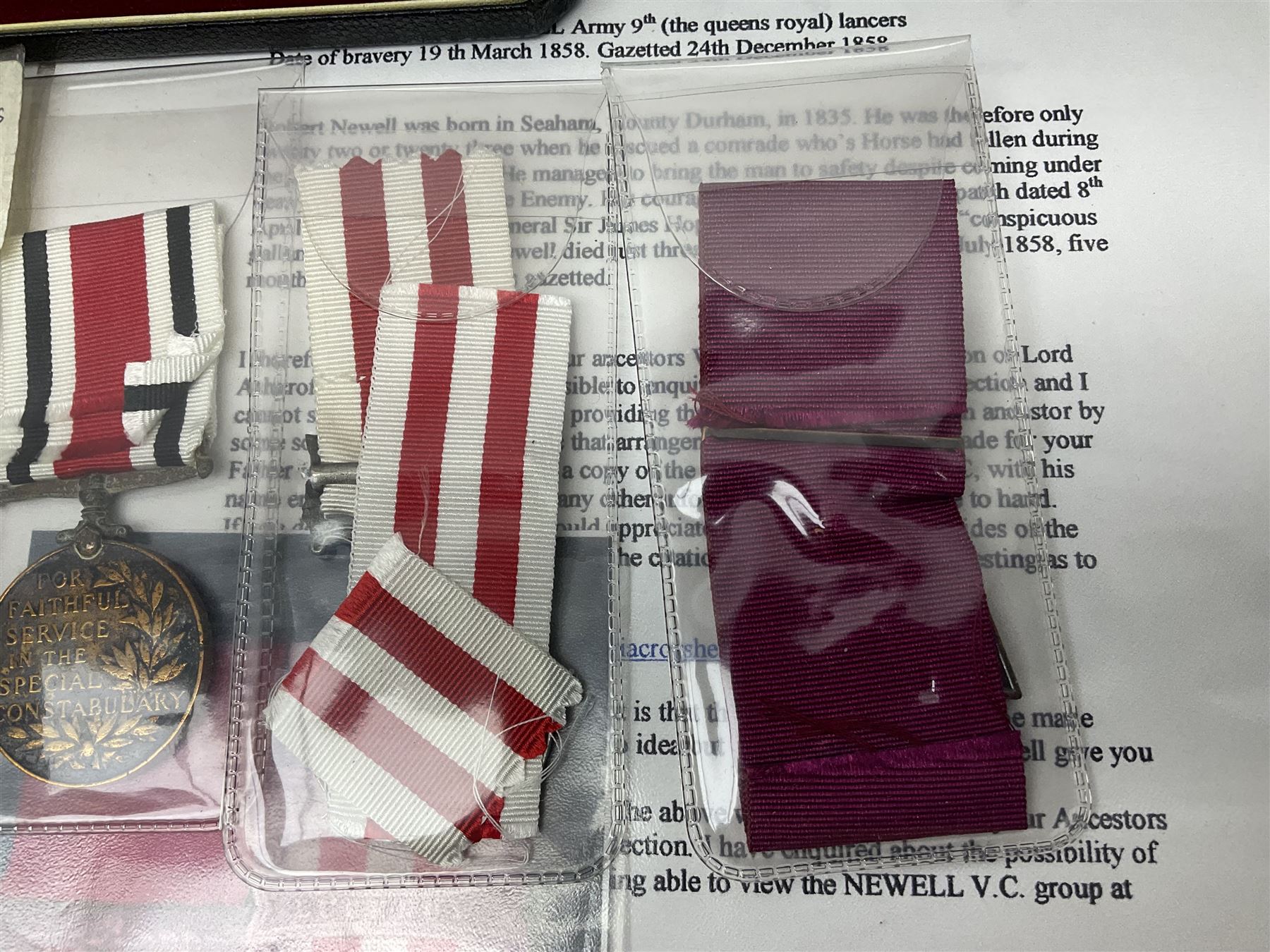 Two Imperial Service Medals to Elsie Hannah Ferguson and Fred Whitehead; each in original case; WWI Special Constabulary Medal to Inspr. Alfred W. Thompson; modern Prisoner of War Medal; cased; replica Victoria Cross and India Mutiny Medals with archive of information relating to Pte. Robert Newell V.C. 9th Lancers; replica Victoria Cross and George Cross with miniatures; and other replica medals etc